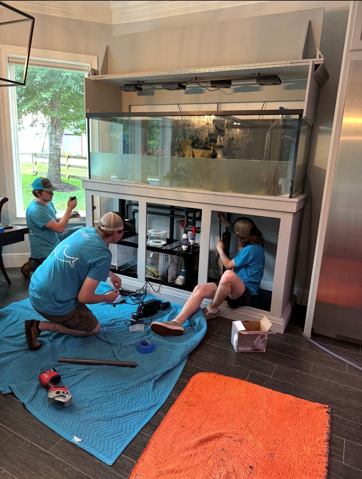 The Limitless Aquariums installation team on site